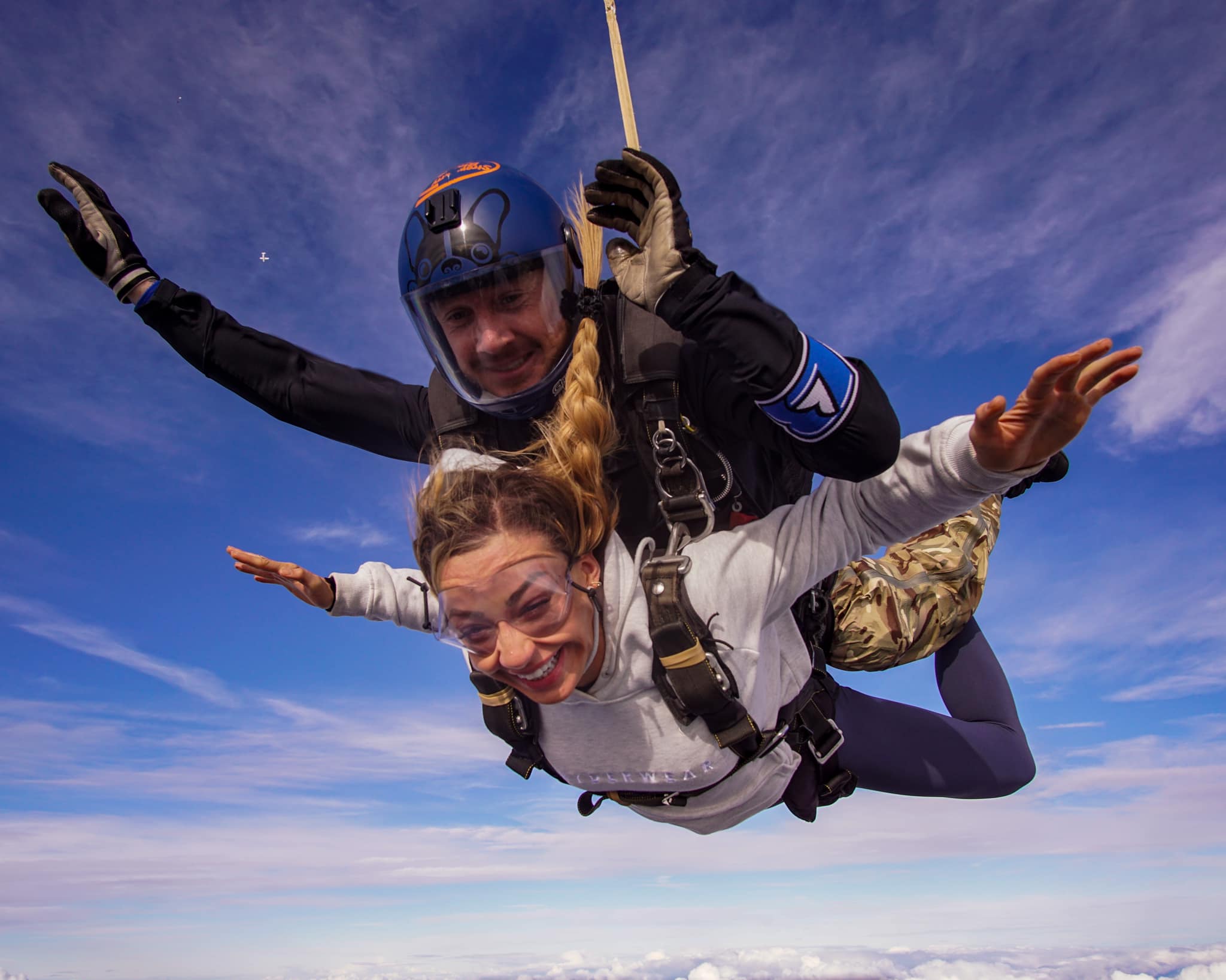 Woman skydiving with Professional on her Back